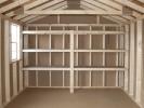 10x16 Peak Style Storage Shed Interior with Built-In Shelving